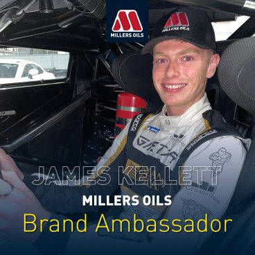 James Kellett sat in a racing car wearing a Millers Oils baseball cap with the text 'James Kellett Millers Oils Brand Ambassador' with Millers Oils logo top centre