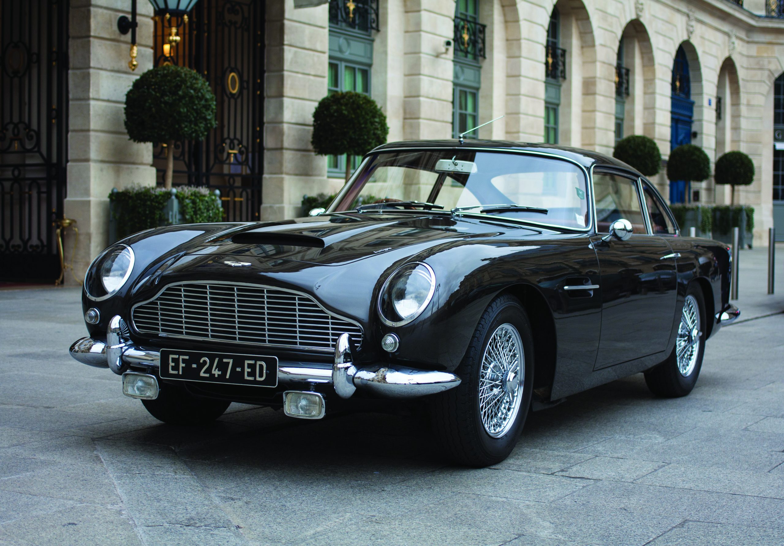 Photo of a classic car in front of a building